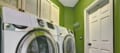 Smaller laundry room with minimal clutter thanks to custom cabinetry